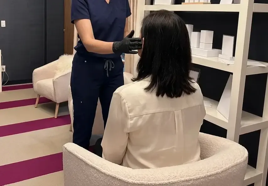 Catherine assessing a patient at a consultation in Bronxville